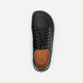 A single black leather lace-up barefoot dance shoe shown from a top-down view on a light gray background. The shoe features a tan interior lining with the brand name 'DeaDos' printed in black.