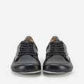 A pair of black leather lace-up barefoot dance sneakers shown from the front against a clean white background.